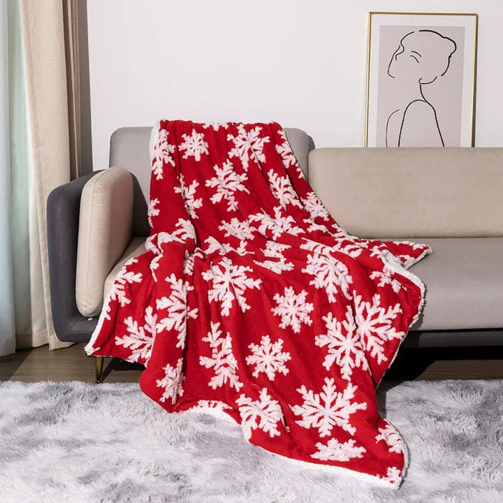 Julepledd i fleece og lammeull med snøkrystaller