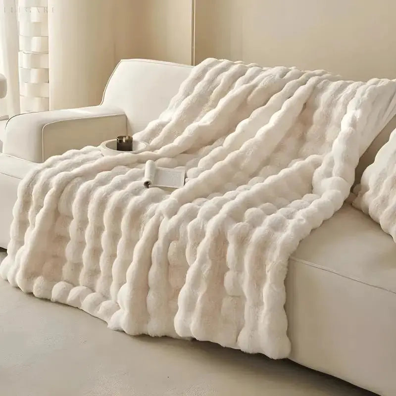Fluffy pledd med boblestruktur og silkemyk følelse