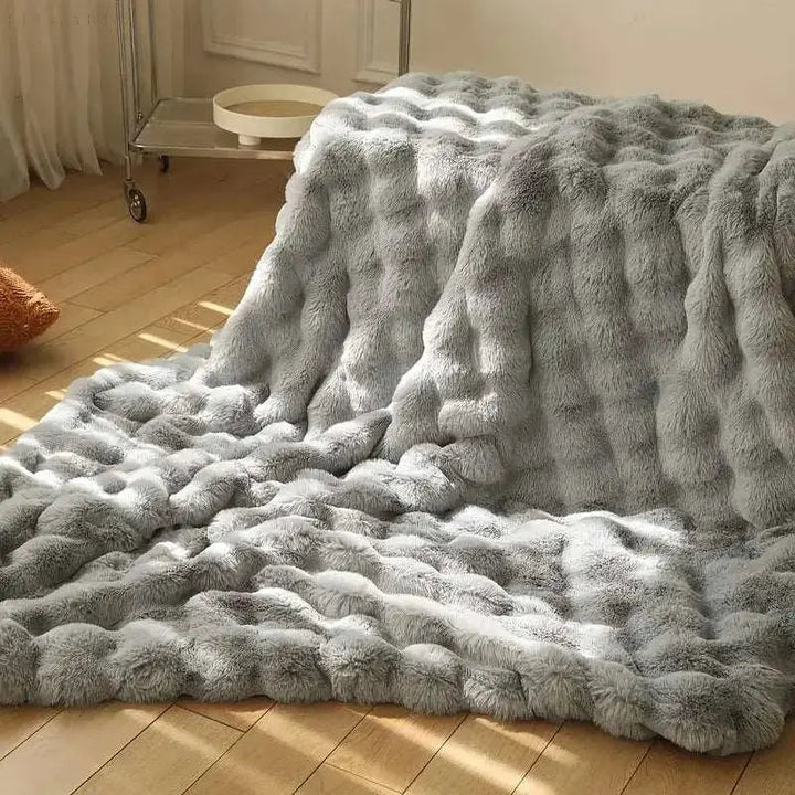 Fluffy pledd med boblestruktur og silkemyk følelse