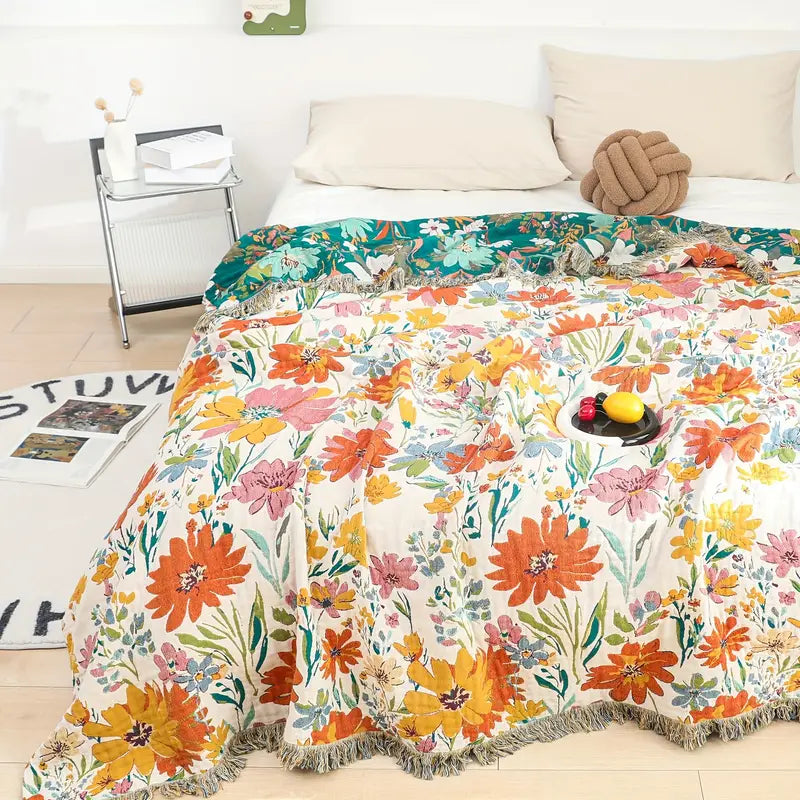 Bomullspledd i jacquard med markblomster for hele året