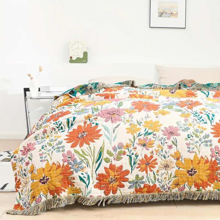 Bomullspledd i jacquard med markblomster for hele året