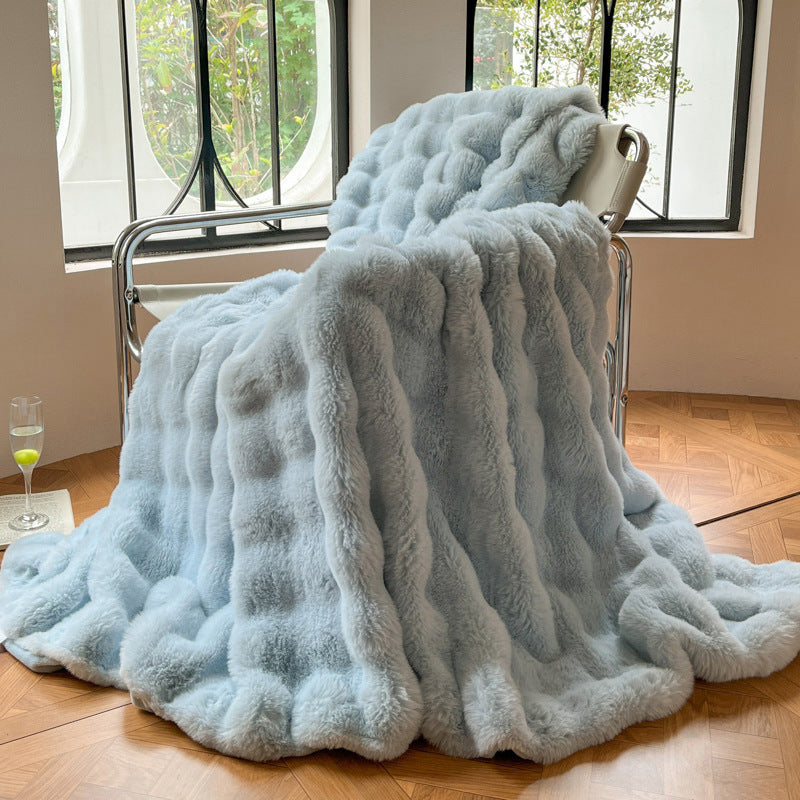 Mykt pledd med elegant bølgestruktur til sofa og seng