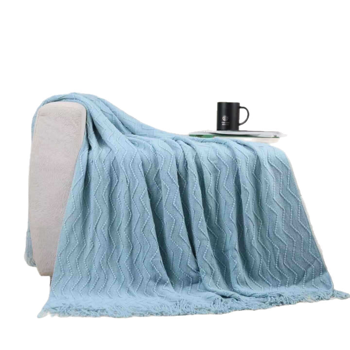 Pledd med struktur til sofa og seng i mykt stoff