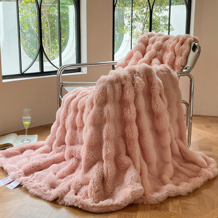 Mykt pledd med elegant bølgestruktur til sofa og seng