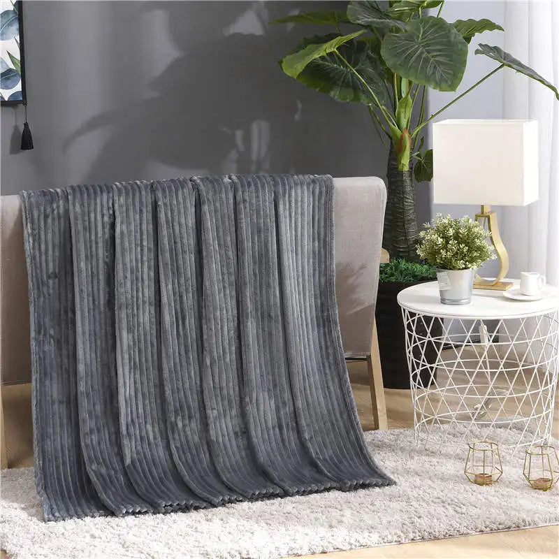 Luftig pledd i flanellfleece med riflet struktur