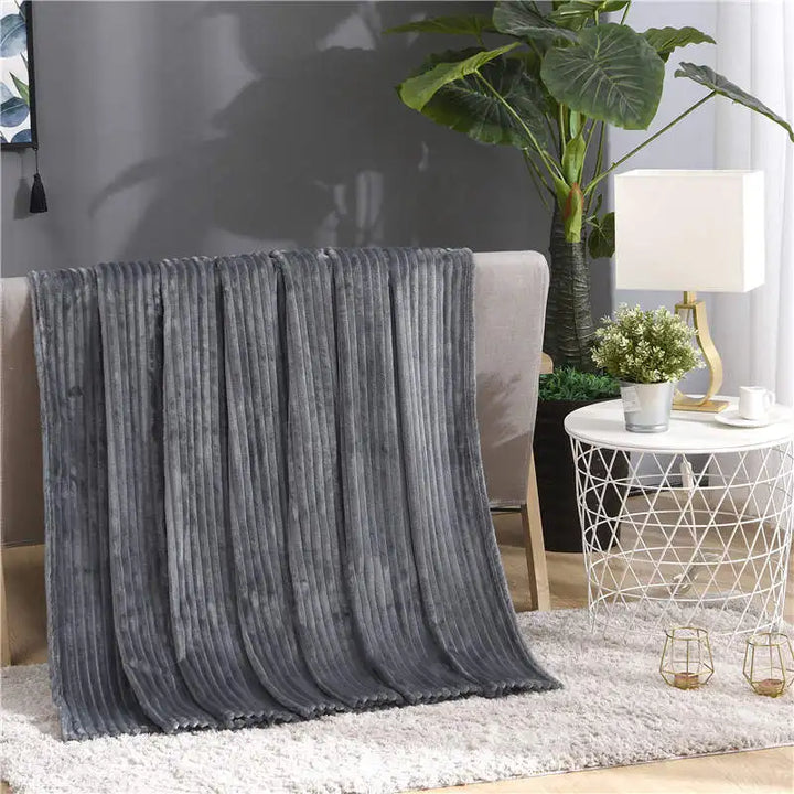 Luftig pledd i flanellfleece med riflet struktur