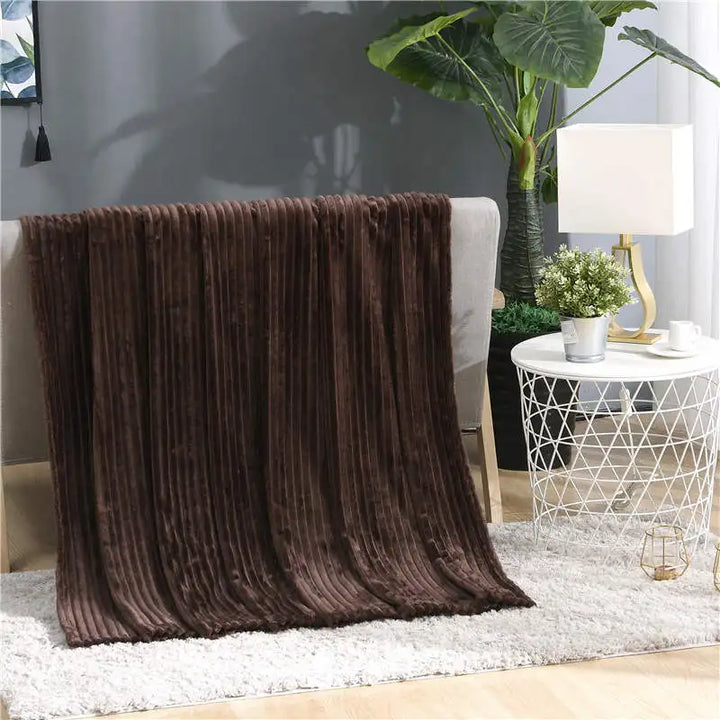 Luftig pledd i flanellfleece med riflet struktur