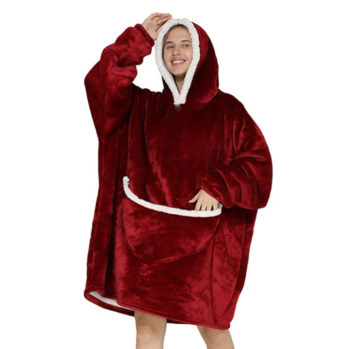 Oversized fleecepledd med hette og romslige lommer