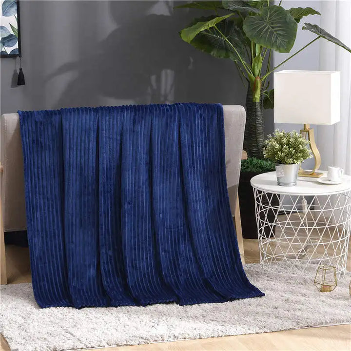 Luftig pledd i flanellfleece med riflet struktur