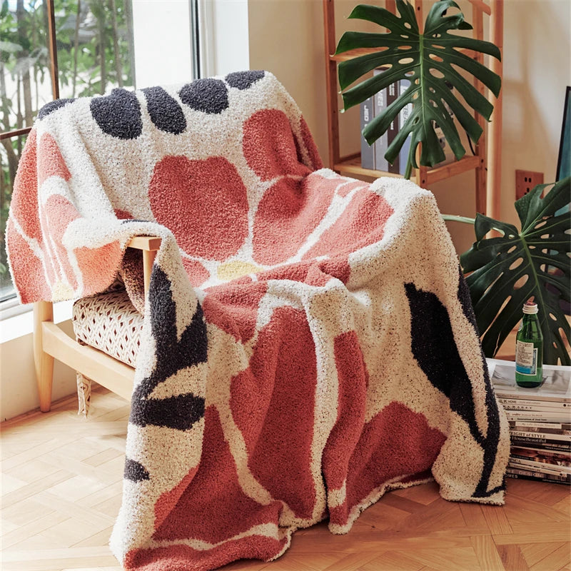 Strikket boho-pledd med blader og blomster i mikrofiber
