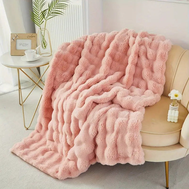 Dobbeltfôret pledd i fuskepels med god tyngde